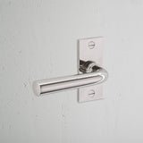 Apsley Short Plate Fixed Door Handle Polished Nickel Finish on White Background at an Angle