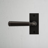 Digby Short Plate Fixed Door Handle Bronze Finish on White Background right Facing Front View