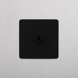 Bronze Intermediate Single Toggle Switch - Practical Tool for Versatile Light Management on White Background