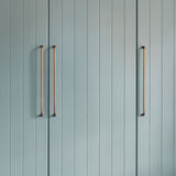 Antique Brass Sycamore Furniture Handle 384mm fitted to a duck egg blue pannelled furniture door 