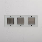 Comprehensive Triple Rocker Switch in Clear Polished Nickel Black - Advanced Light Control Tool on White Background