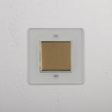 Efficient Light Management Accessory: Central Single Rocker Switch in Clear Antique Brass White on White Background