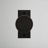 Onslow Short Plate Fixed Door Knob Bronze Finish on White Background right Facing Front View