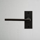 Clayton Short Plate Fixed Door Handle Bronze Finish on White Background right Facing Front View
