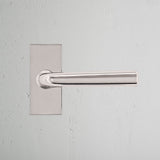 Apsley Short Plate Fixed Door Handle Polished Nickel Finish on White Background Front Facing