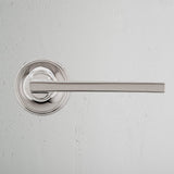 Clayton Unsprung Door Handle Polished Nickel Finish on White Background Front Facing